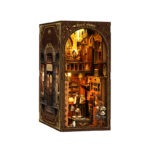 Royal Tailor Shop Book Nook vintage miniature clothing store with warm LED lighting, elegant wooden interior, tailor workspace, fabric shelves, fashion details, and DIY book nook decoration.