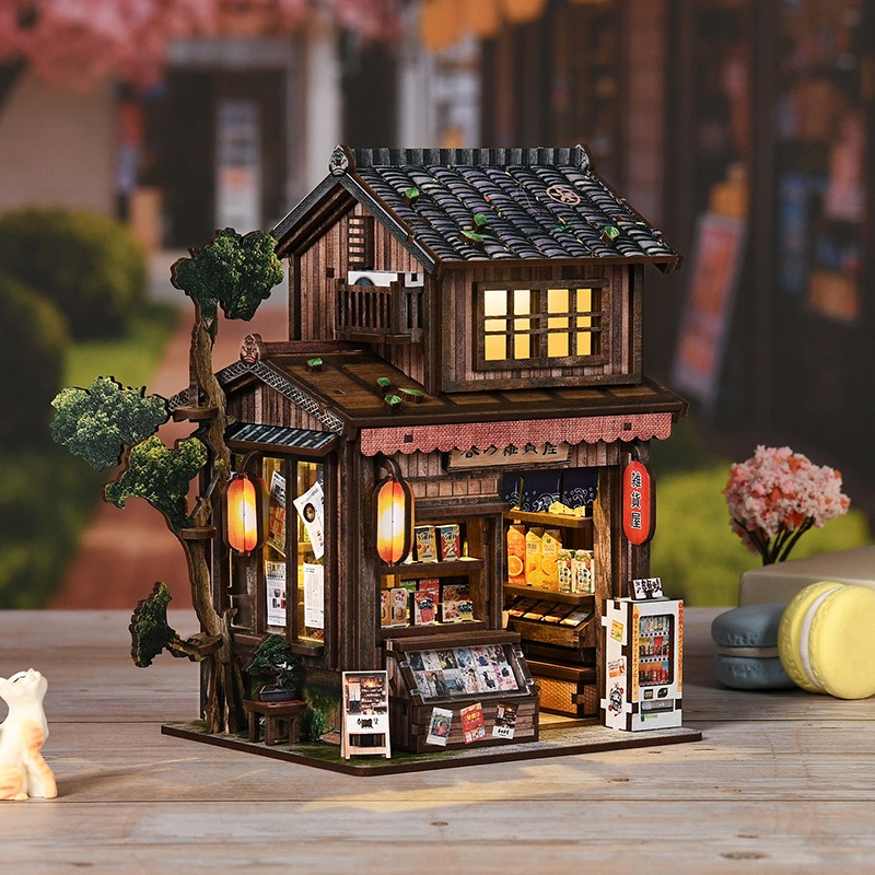 Japanische Bar Book Nook Miniatur mit traditionellem Ladenstil, warmen Laternen, Holzdetails und gemütlicher LED-Beleuchtung für eine stimmungsvolle Dekoration.