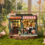 Flower House Book Nook als Miniatur-Blumenladen mit warmem LED-Licht, Blumen, Dekoration und gemütlicher Gartenszene