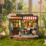 Flower House Book Nook als Miniatur-Blumenladen mit warmem LED-Licht, Blumen, Dekoration und gemütlicher Gartenszene
