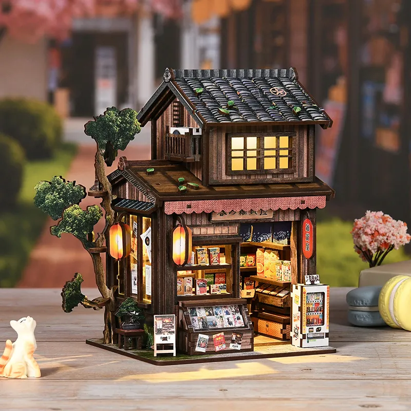 Japanischer Book Nook mit traditioneller Miniaturstraße und warmer Beleuchtung