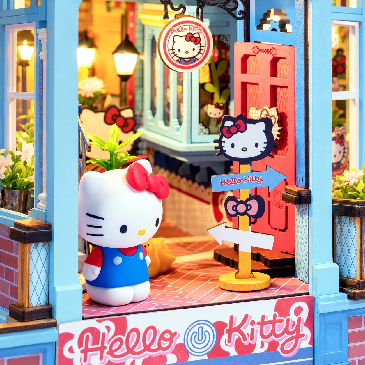 Hello Kitty Town Square Book Nook mit Figur und Wegweiser