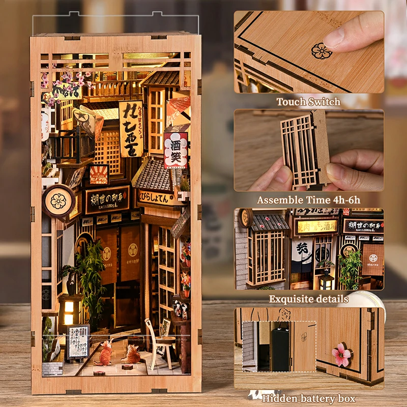 Japanisches Book Nook mit beleuchtetem Miniaturladen neben den einzelnen Bauteilen während des Zusammenbaus